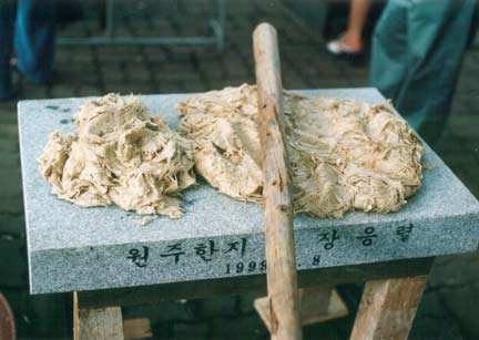 mulberry for Korean Hanji Hand Made Paper is beaten on a stone