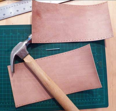 Making the stitching holes on the oar leather