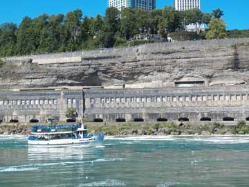 Maid of the Mist in front of power plant in Limestone wall