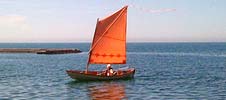 skerry sailboat with polytarp sail